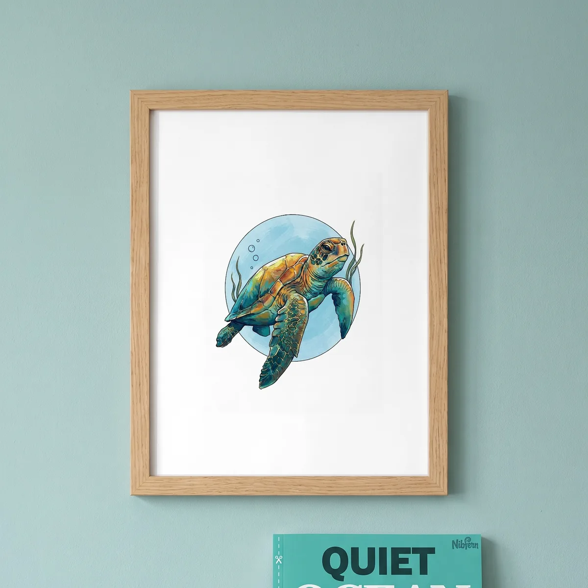 A colored sea turtle page in a wooden frame on a sea-green wall